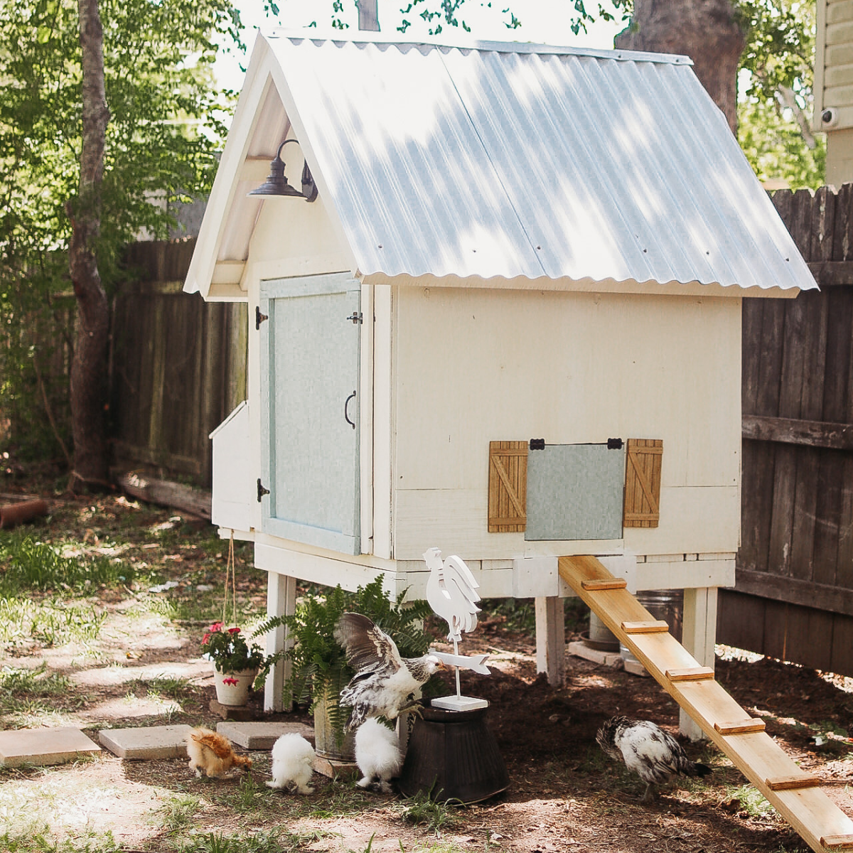 blue and white farmhouse style chicken coop