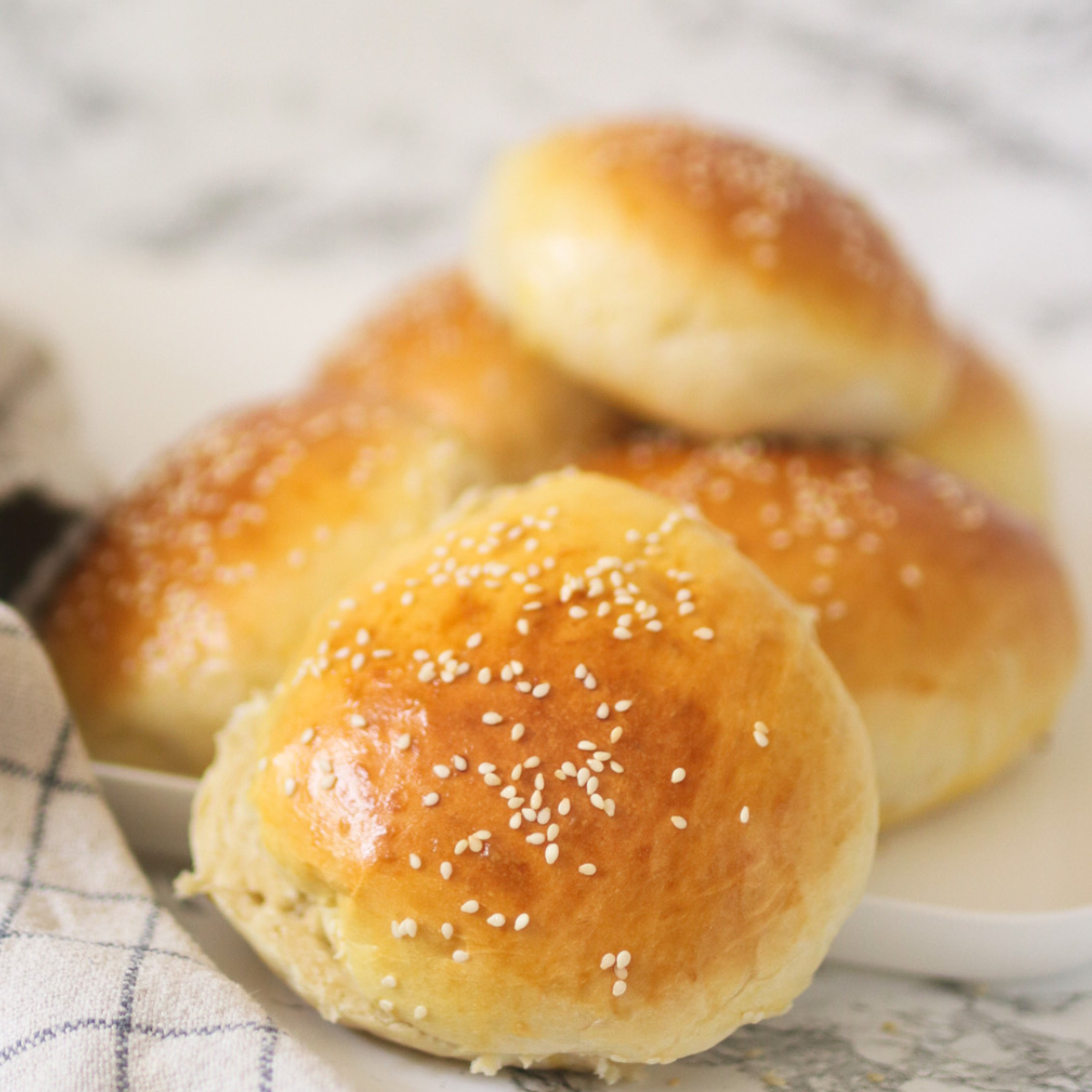 huge hamburger buns on counter image